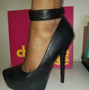 Black pumps with ankle straps